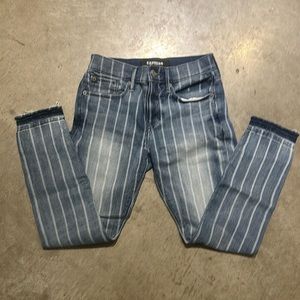 Express raw edge stripped skinny jeans